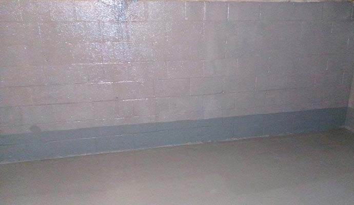An interior view of a basement masonry wall