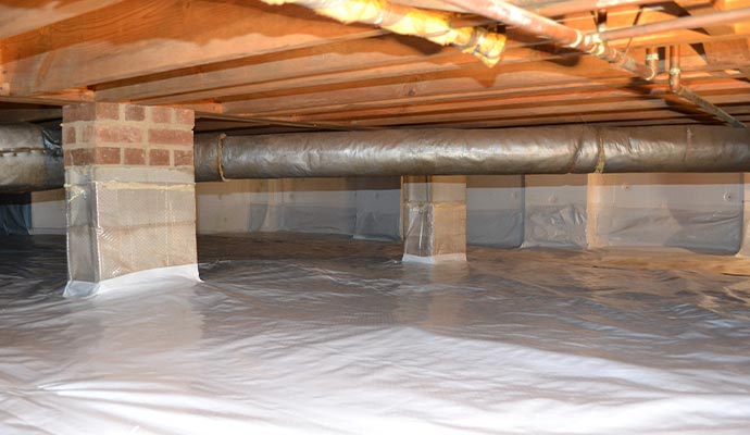 Encapsulated crawl space with vapor barrier