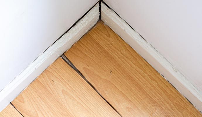 Damaged wooden floor corner