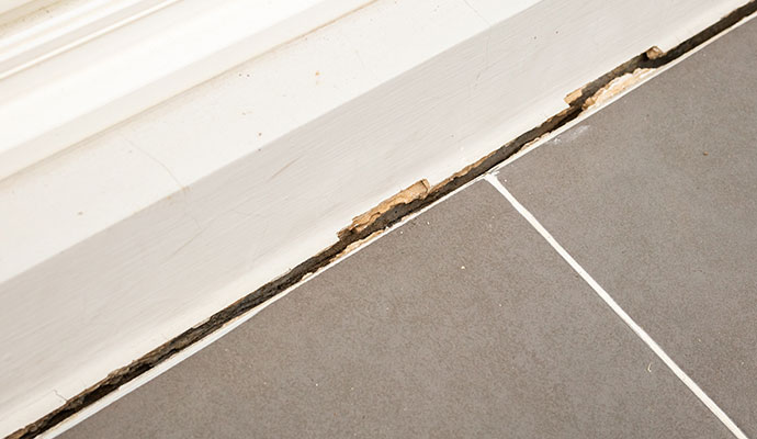 Visible gap between the base of the wall and floor due to foundation issue