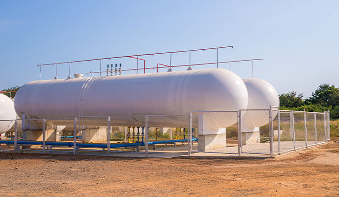Large white industrial tanks for commercial propane or LPG storage