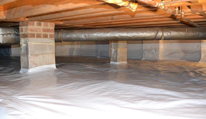 Installed crawl space vapor barrier in the basement
