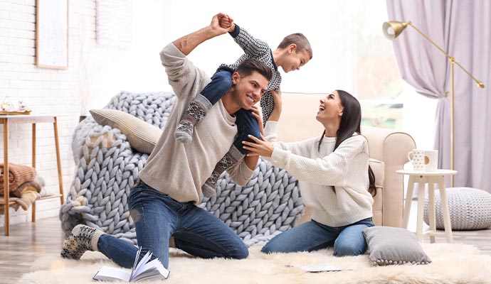 Happy family playing in healthy environment