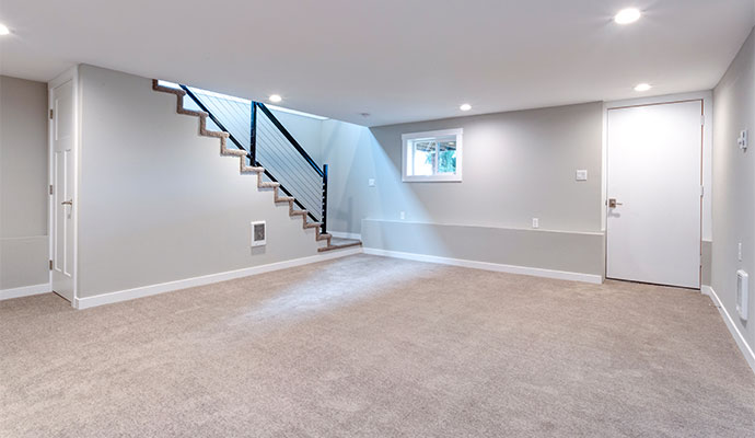 Waterproofed basement with repaired foundation walls and floors