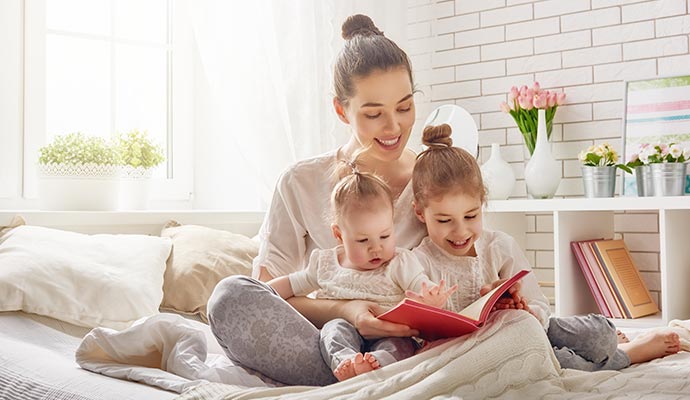 Woman with babies enjoying indoor air quality Woman with babies enjoying indoor air quality